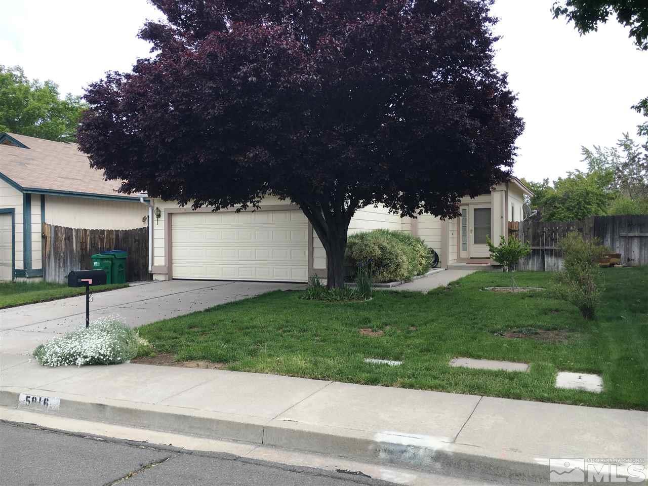 5816 Coyote Ridge Road Reno, NV 89523 - Photo 1 of 1 a view of a house with a small garden and a tree