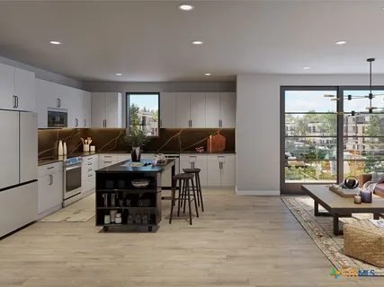 a living room with furniture and a dining table with kitchen view
