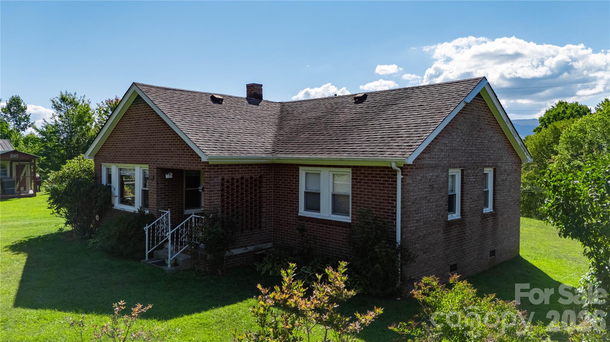 580 Russ Norris Heaton Road Elk Park, NC 28622 - Photo 2 of 42 a front view of a house with a yard