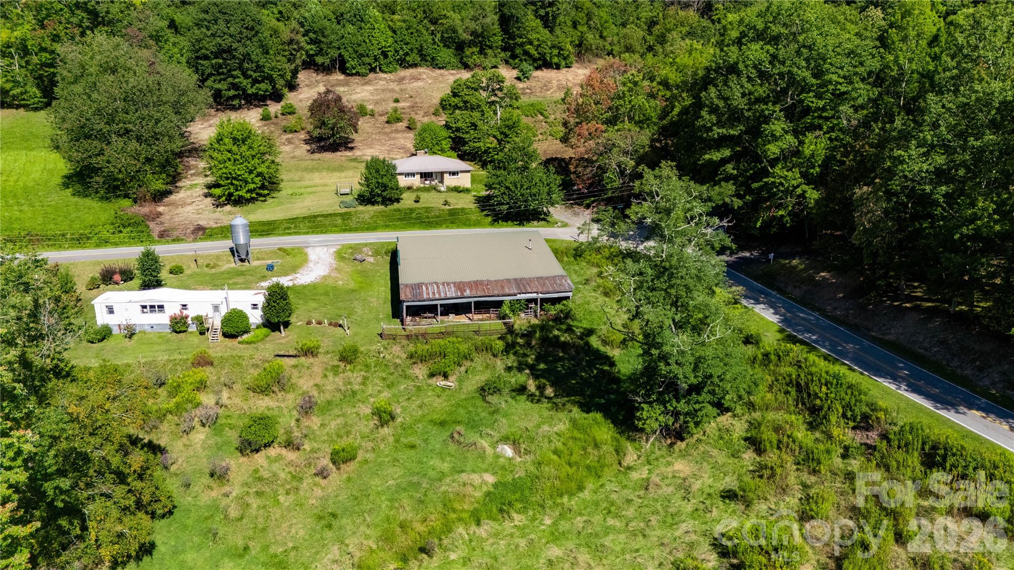 580 Russ Norris Heaton Road Elk Park, NC 28622 - Photo 23 of 42 an aerial view of a house with a yard