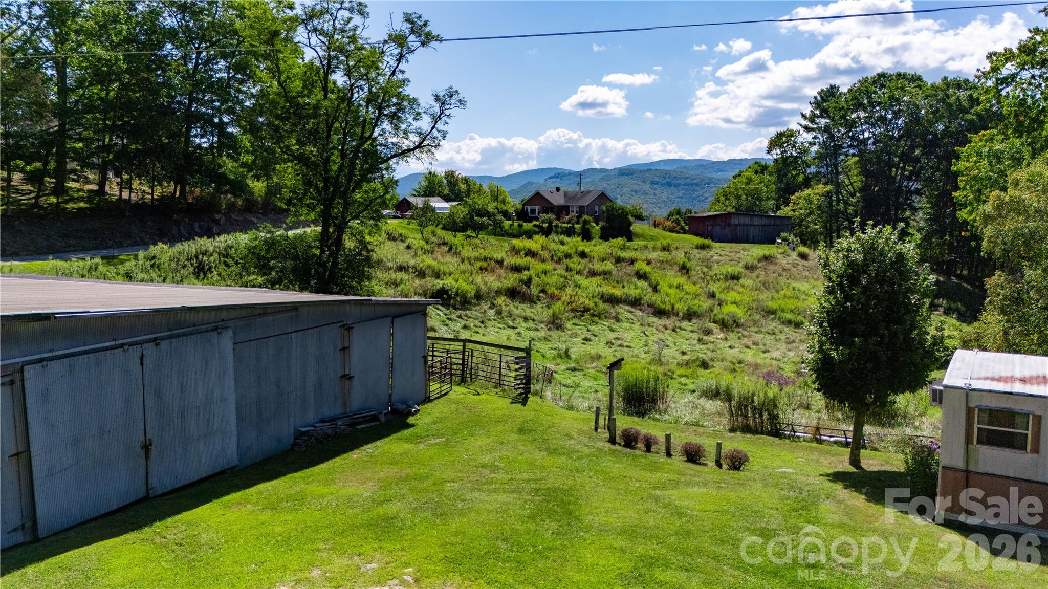 580 Russ Norris Heaton Road Elk Park, NC 28622 - Photo 26 of 42 a view of a backyard with a garden