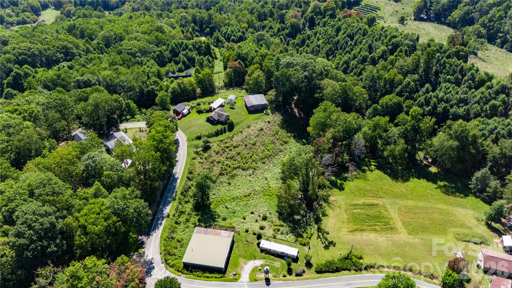 580 Russ Norris Heaton Road Elk Park, NC 28622 - Photo 4 of 42 an aerial view of a house with a yard