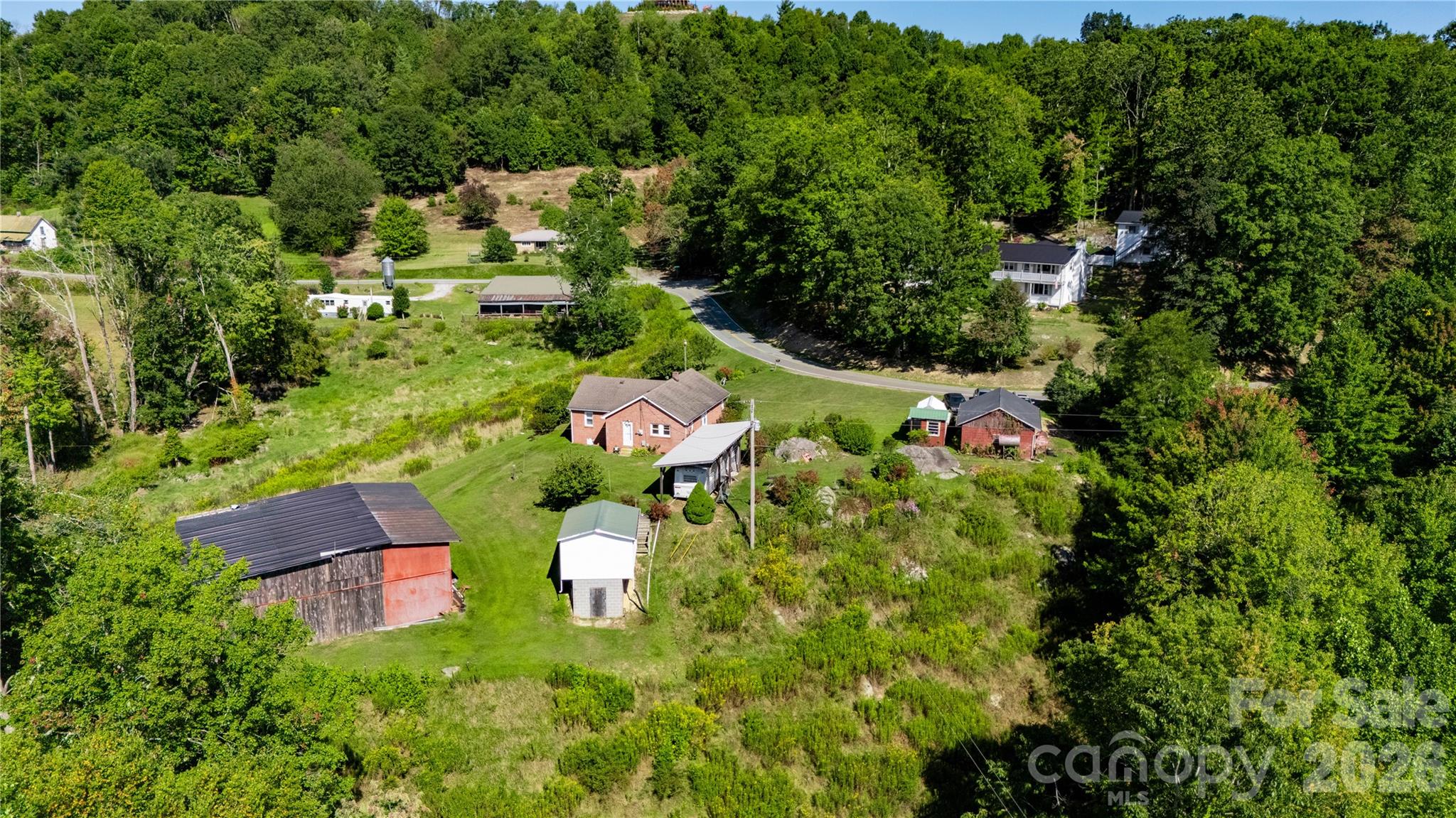580 Russ Norris Heaton Road Elk Park, NC 28622 - Photo 6 of 42 an aerial view of residential house with outdoor space and trees all around