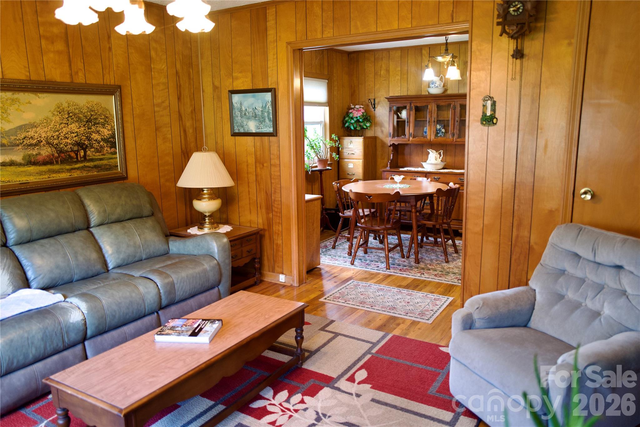 580 Russ Norris Heaton Road Elk Park, NC 28622 - Photo 10 of 42 a living room with furniture a dining table and a lamp