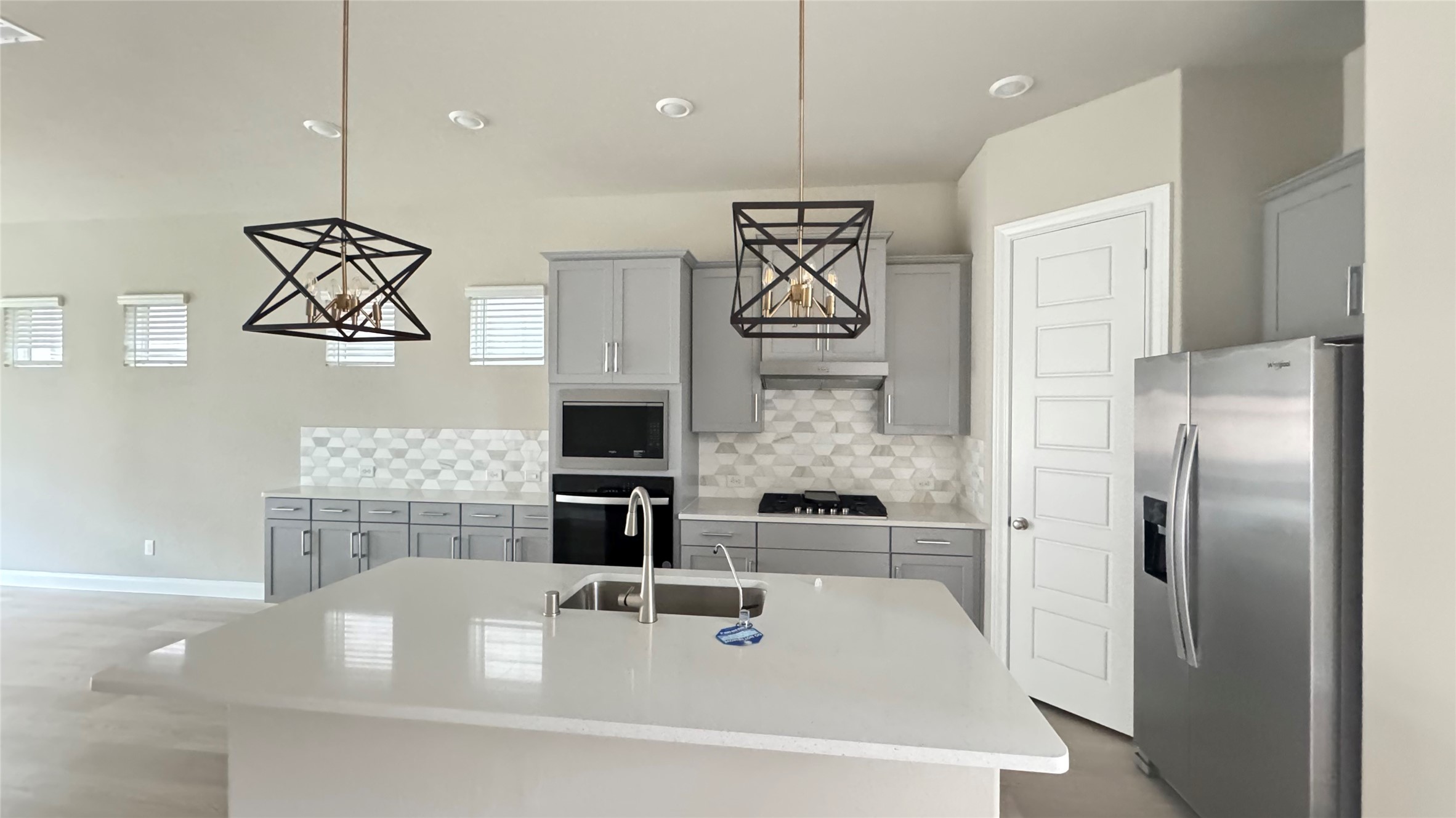3005 Manor Heights Lane Houston, TX 77063 - Photo 11 of 35 a kitchen with stainless steel appliances a refrigerator and a stove