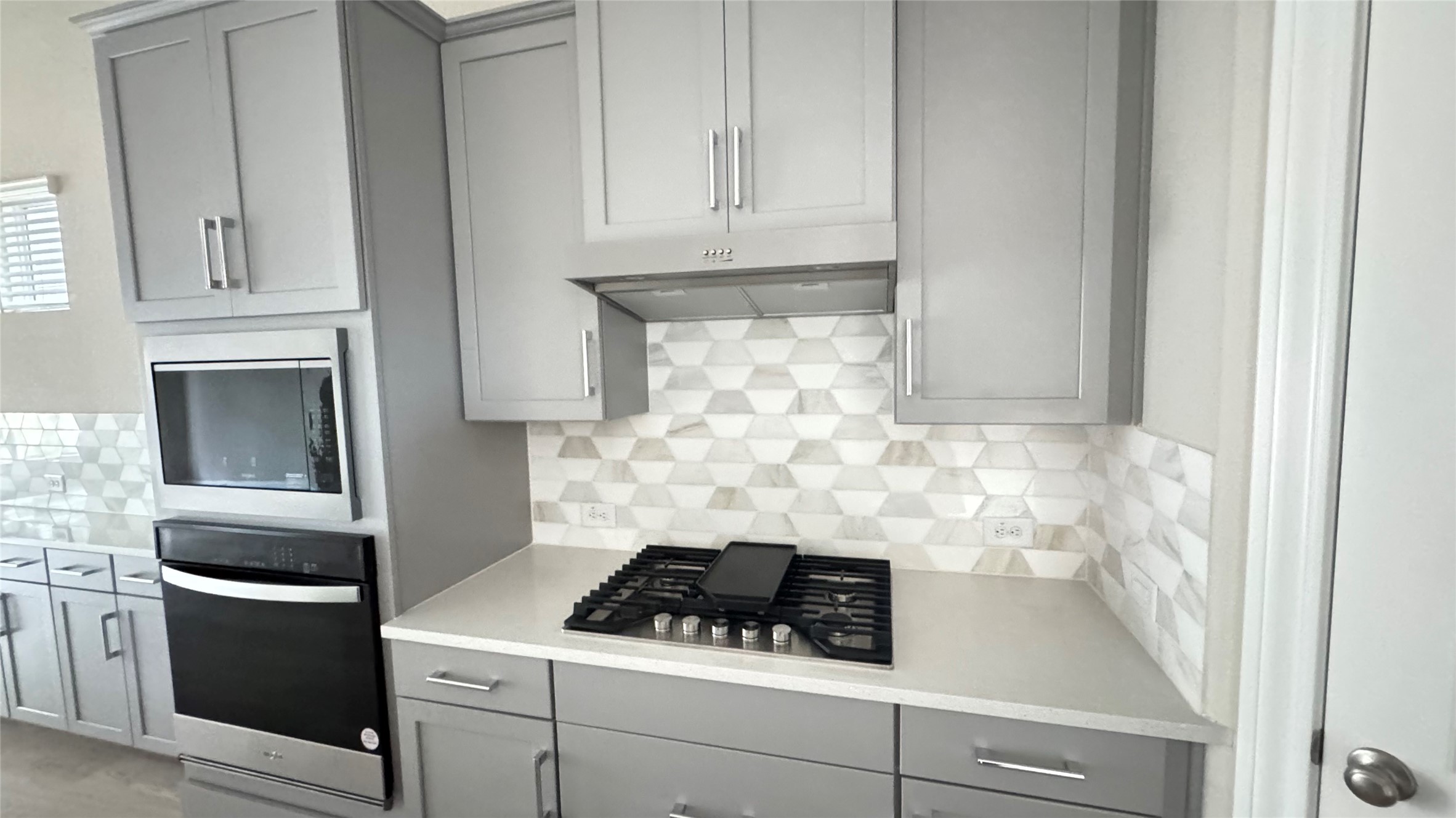 3005 Manor Heights Lane Houston, TX 77063 - Photo 13 of 35 a kitchen with white cabinets and white appliances