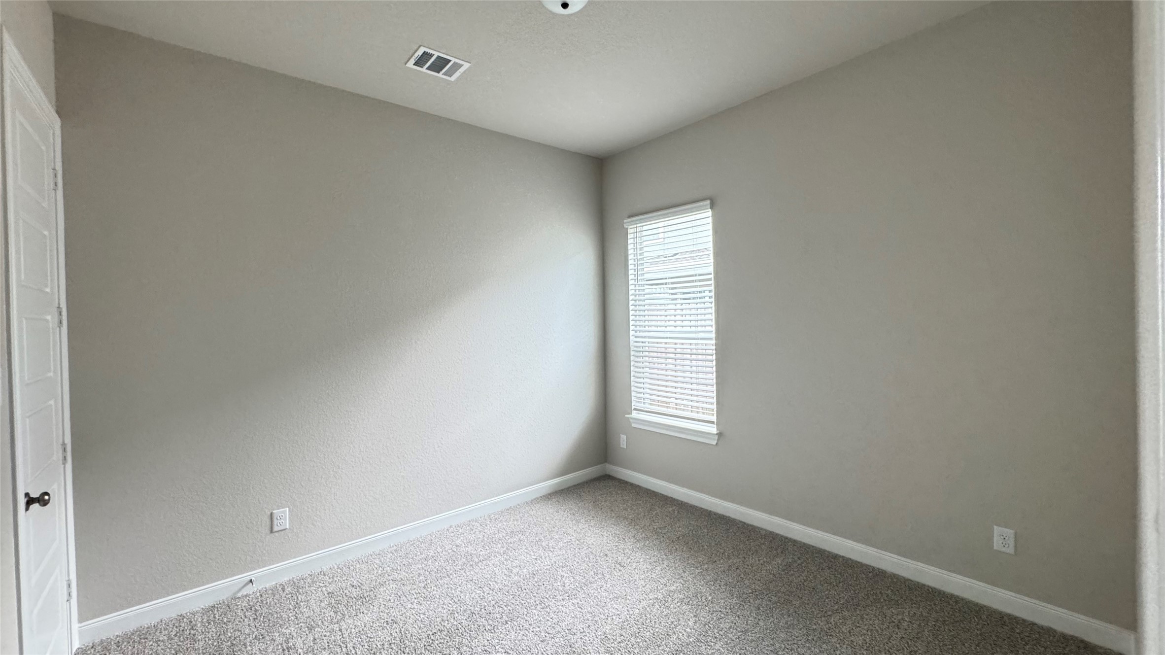 3005 Manor Heights Lane Houston, TX 77063 - Photo 16 of 35 an empty room with windows