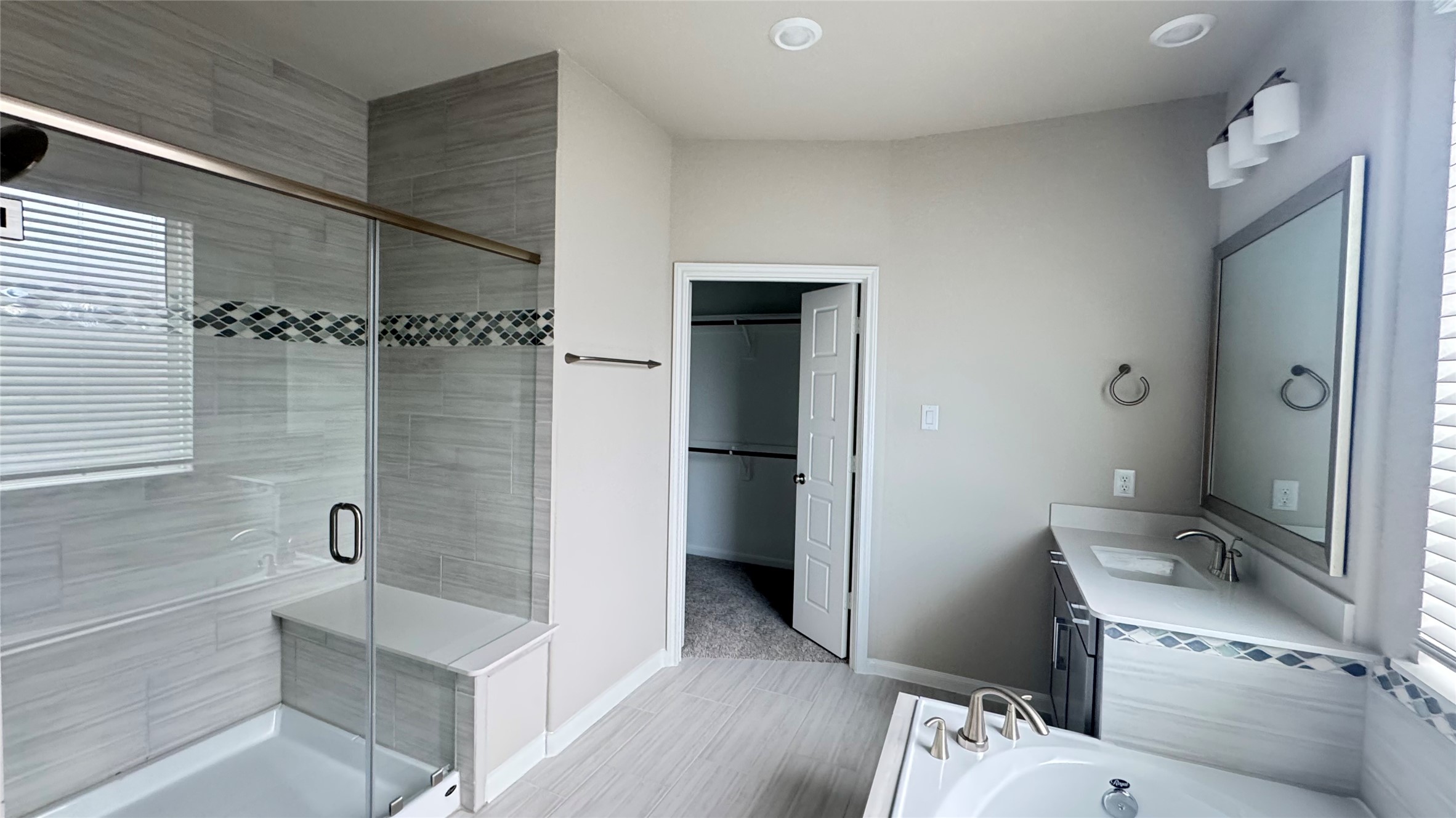 3005 Manor Heights Lane Houston, TX 77063 - Photo 21 of 35 a bathroom with a granite countertop sink a toilet and shower
