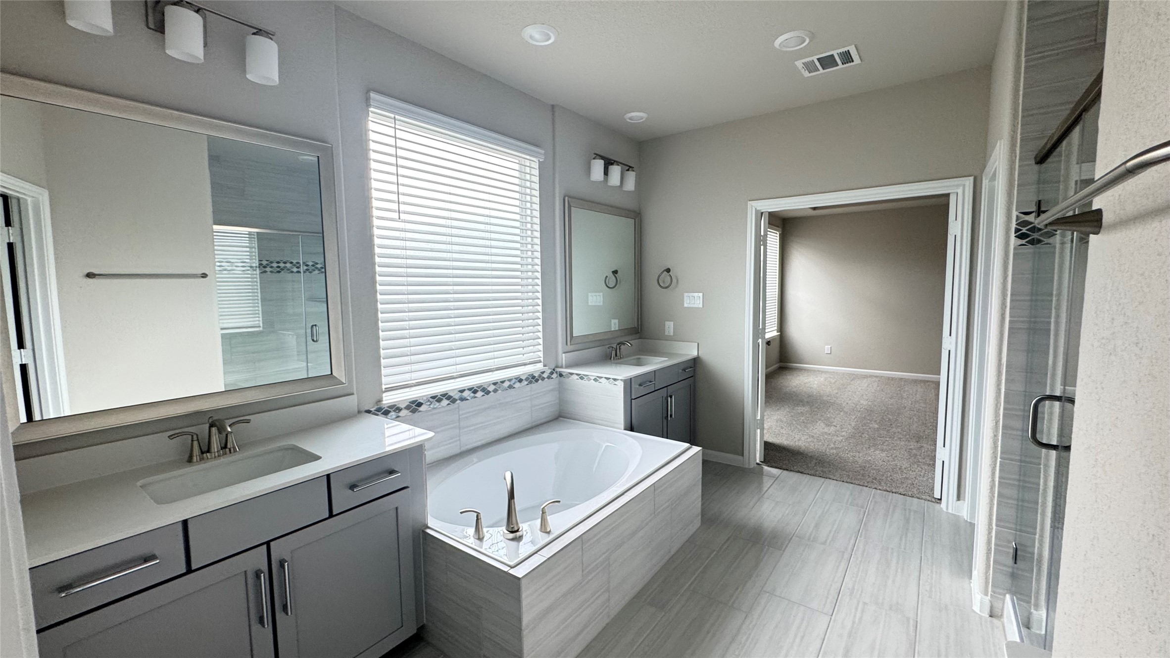 3005 Manor Heights Lane Houston, TX 77063 - Photo 24 of 35 a bathroom with a sink and a mirror