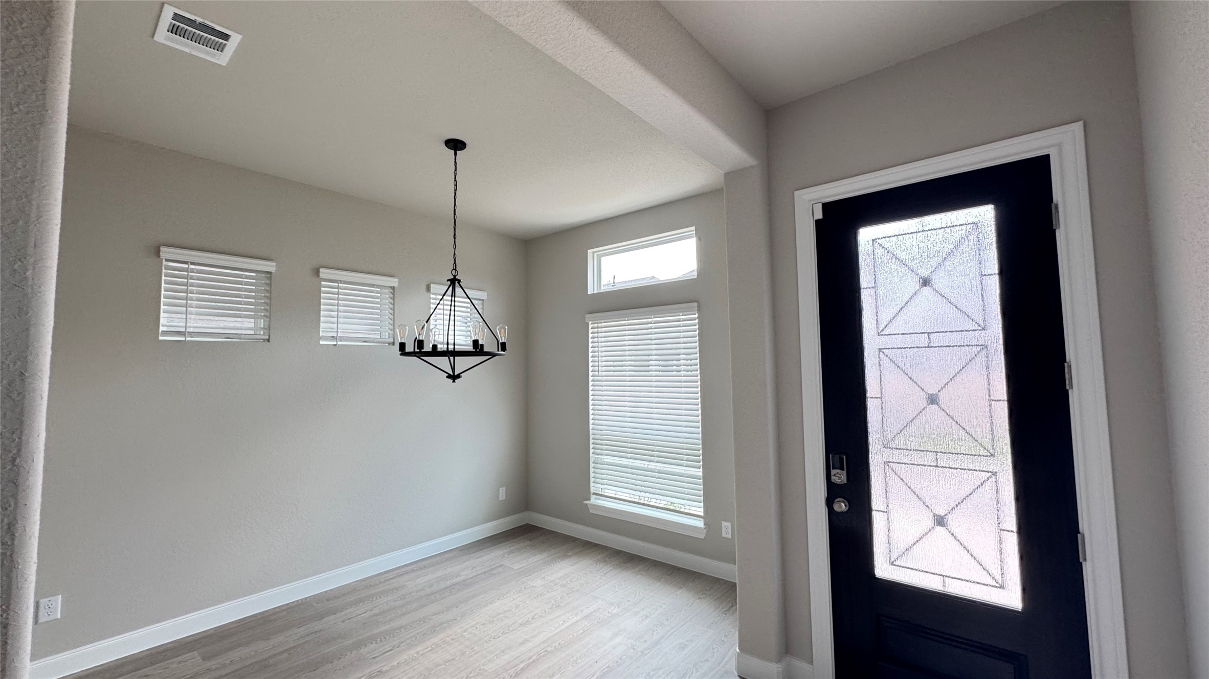 3005 Manor Heights Lane Houston, TX 77063 - Photo 4 of 35 a view of empty room with wooden floor and fan