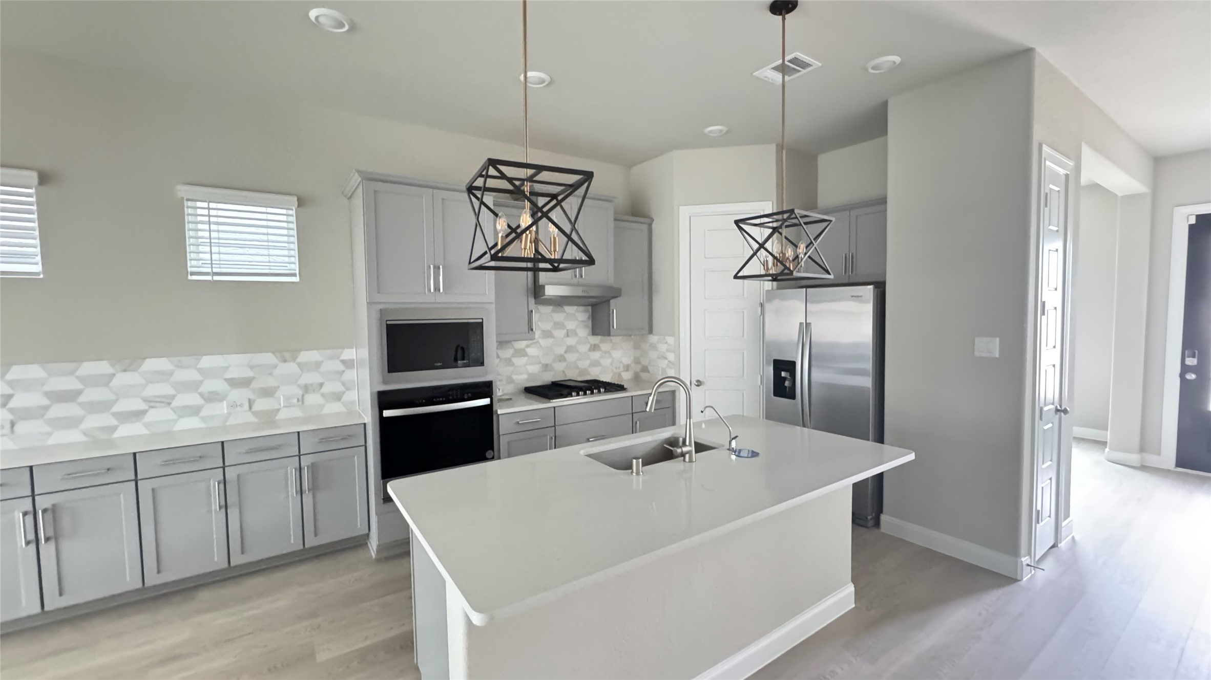 3005 Manor Heights Lane Houston, TX 77063 - Photo 6 of 35 a kitchen with a sink appliances and cabinets