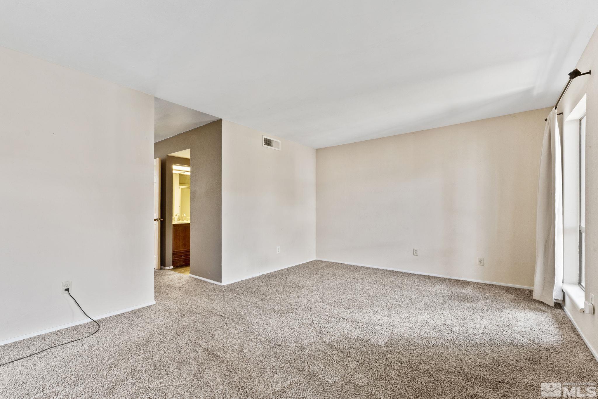 4185 Baker Lane Reno, NV 89509 - Photo 11 of 29 a view of an empty room with a window