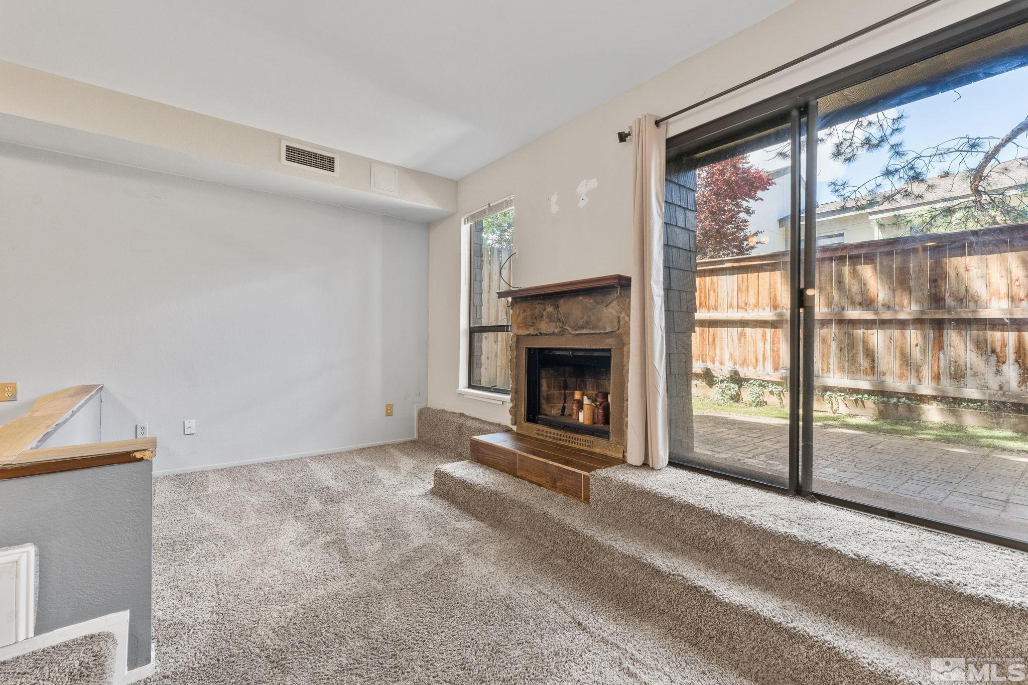 4185 Baker Lane Reno, NV 89509 - Photo 12 of 29 a view of an empty room with a fireplace