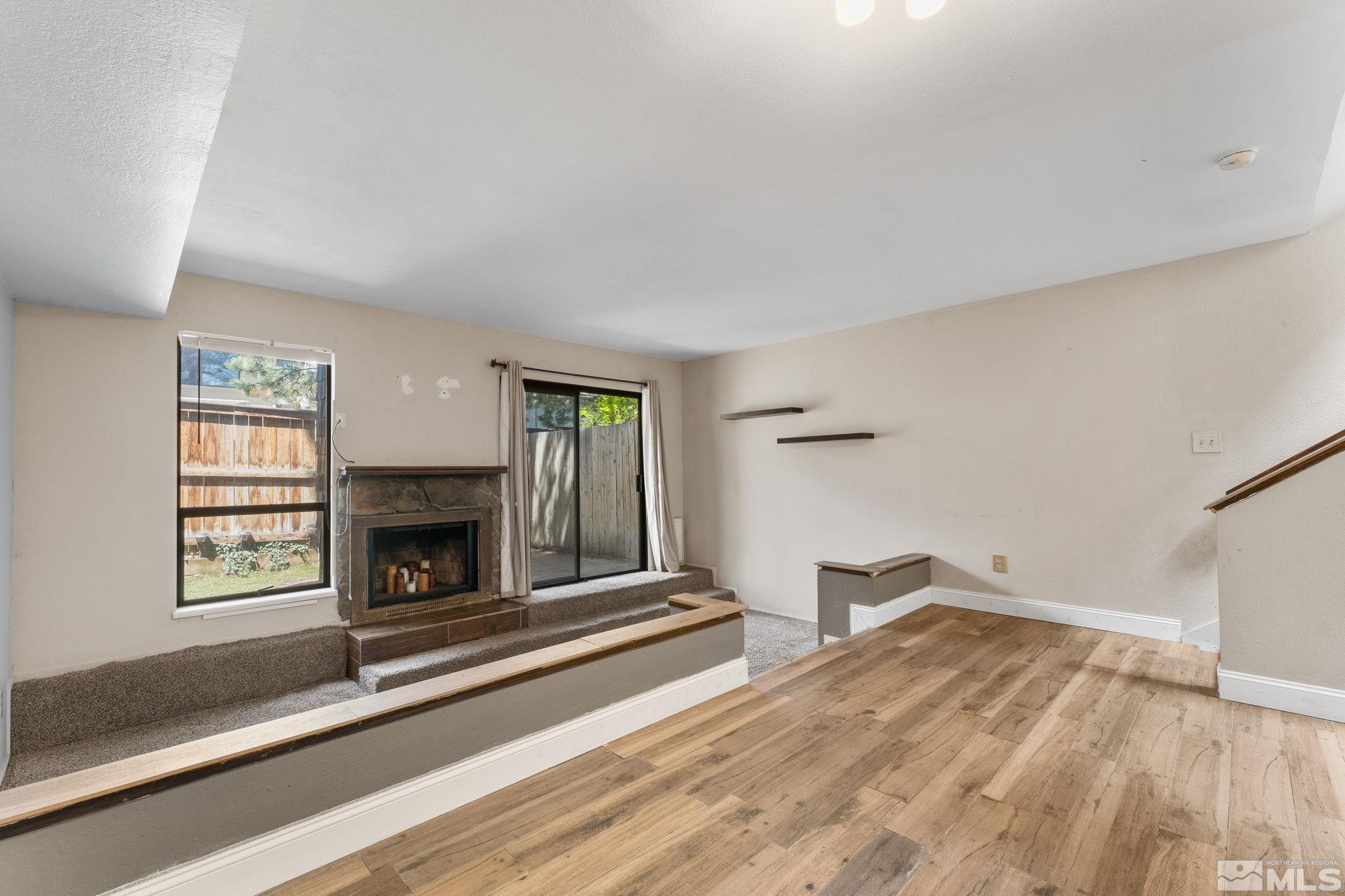 4185 Baker Lane Reno, NV 89509 - Photo 14 of 29 a living room with furniture and a fireplace