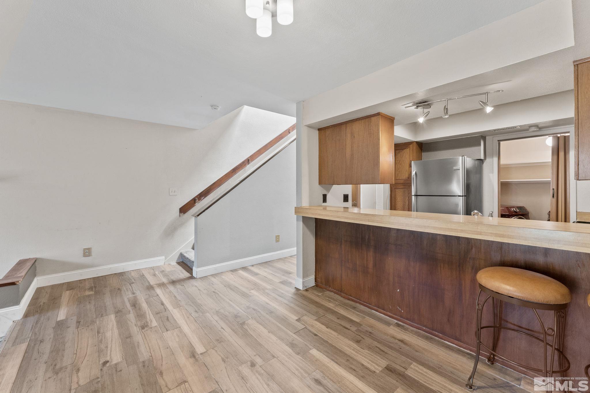 4185 Baker Lane Reno, NV 89509 - Photo 17 of 29 a view of kitchen and hall with wooden floor