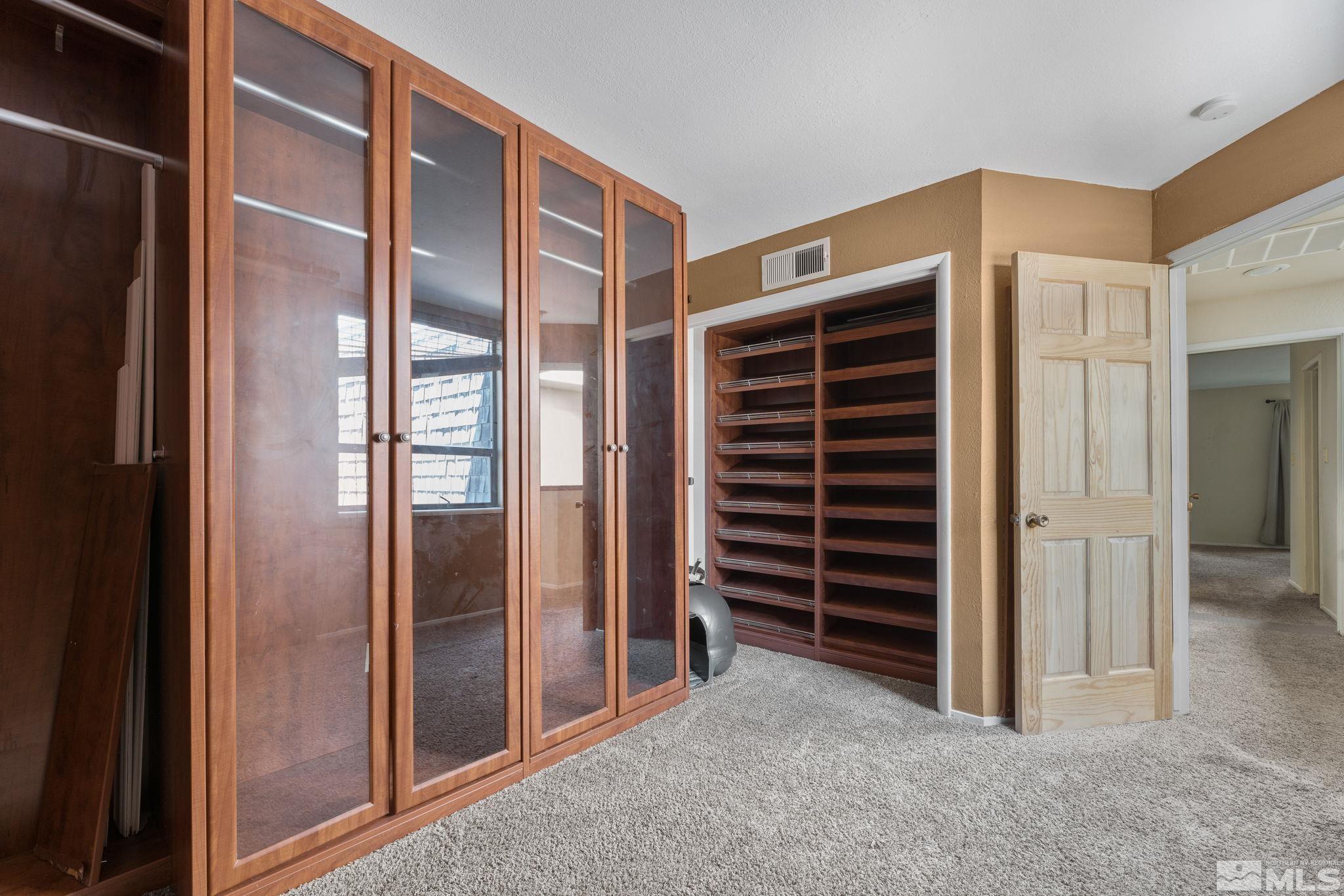 4185 Baker Lane Reno, NV 89509 - Photo 23 of 29 a view of walk in closet and bedroom view