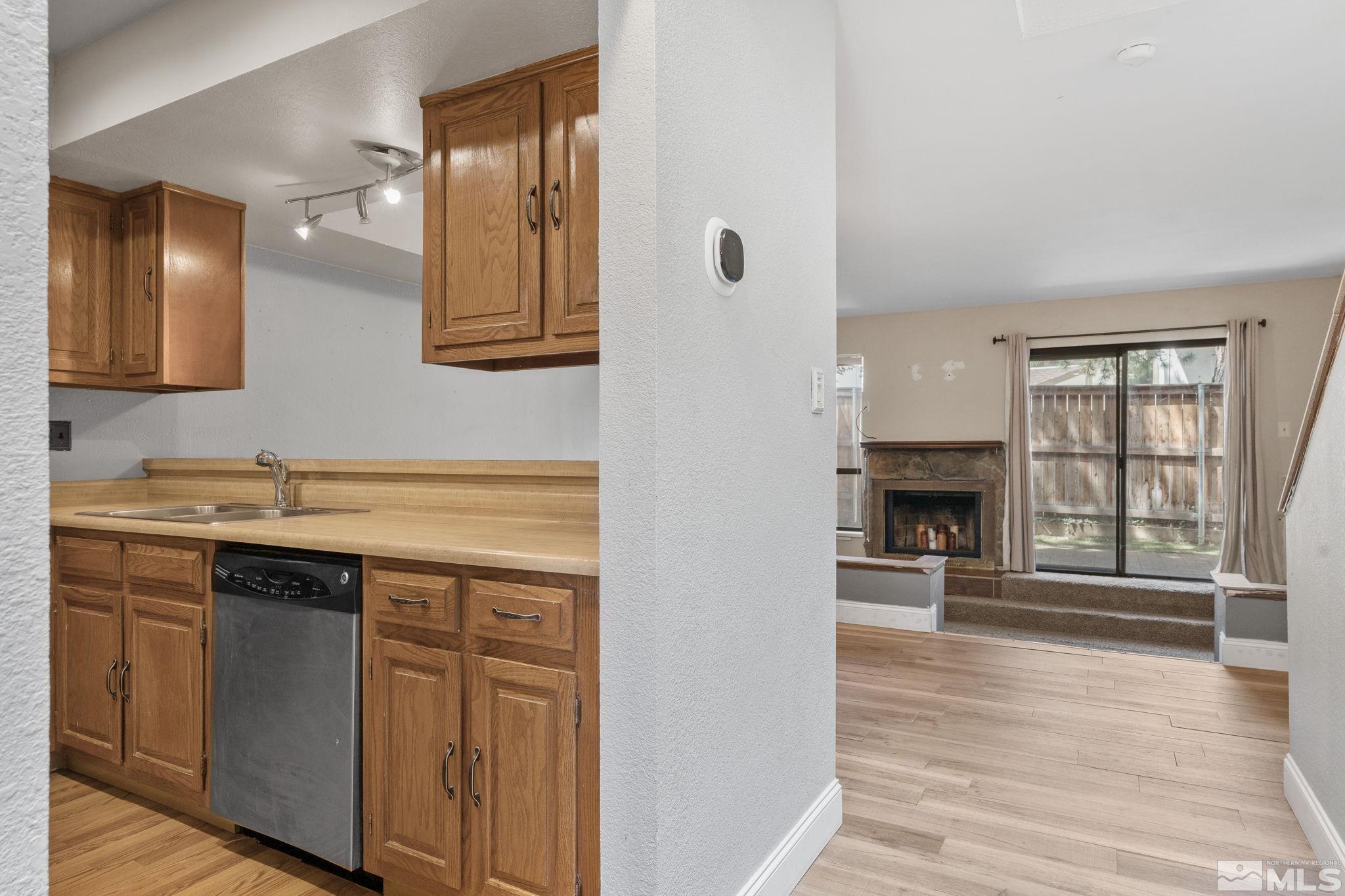 4185 Baker Lane Reno, NV 89509 - Photo 3 of 29 a view of an empty room with window and wooden floor