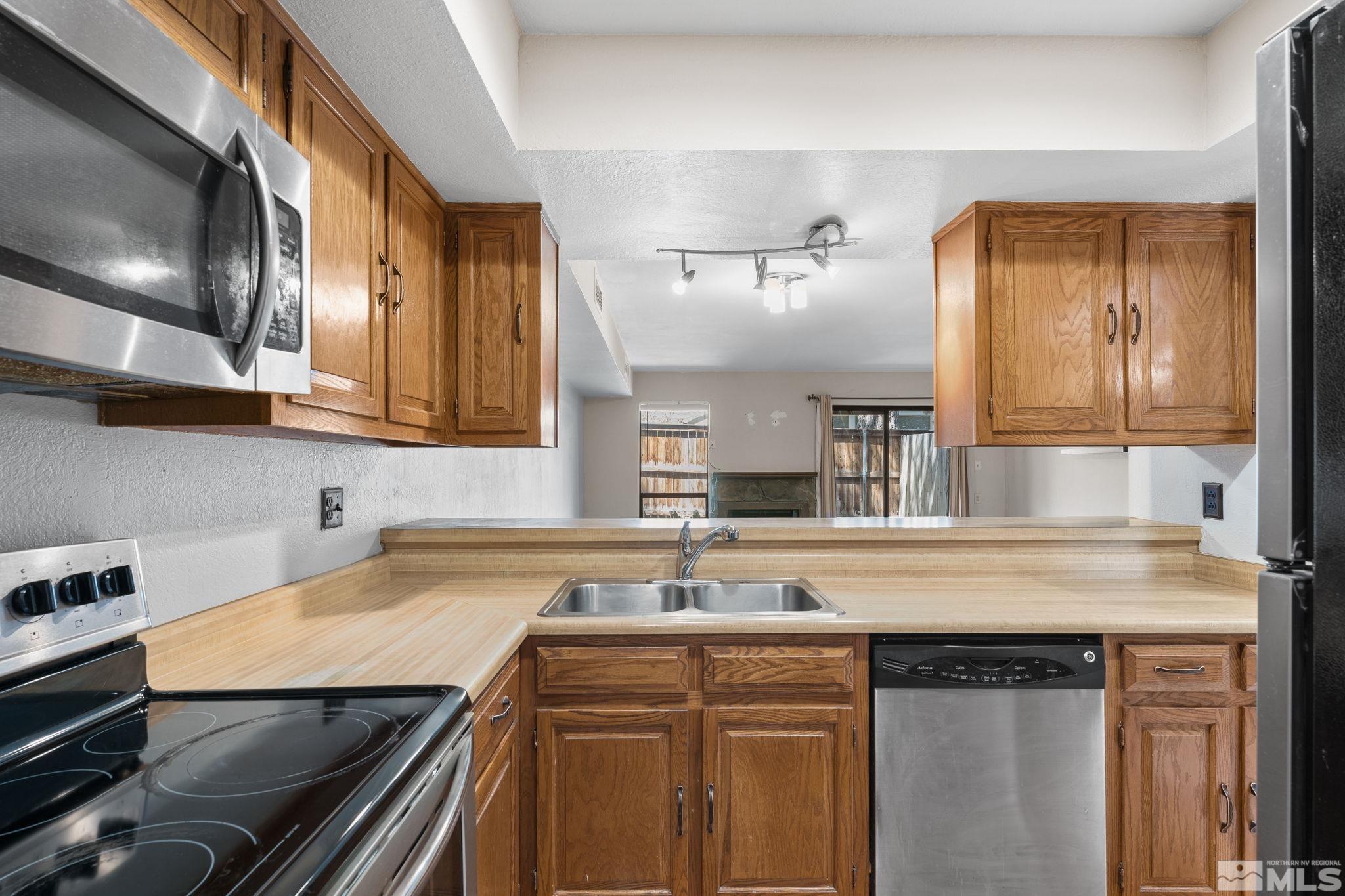 4185 Baker Lane Reno, NV 89509 - Photo 5 of 29 a kitchen with a sink and cabinets