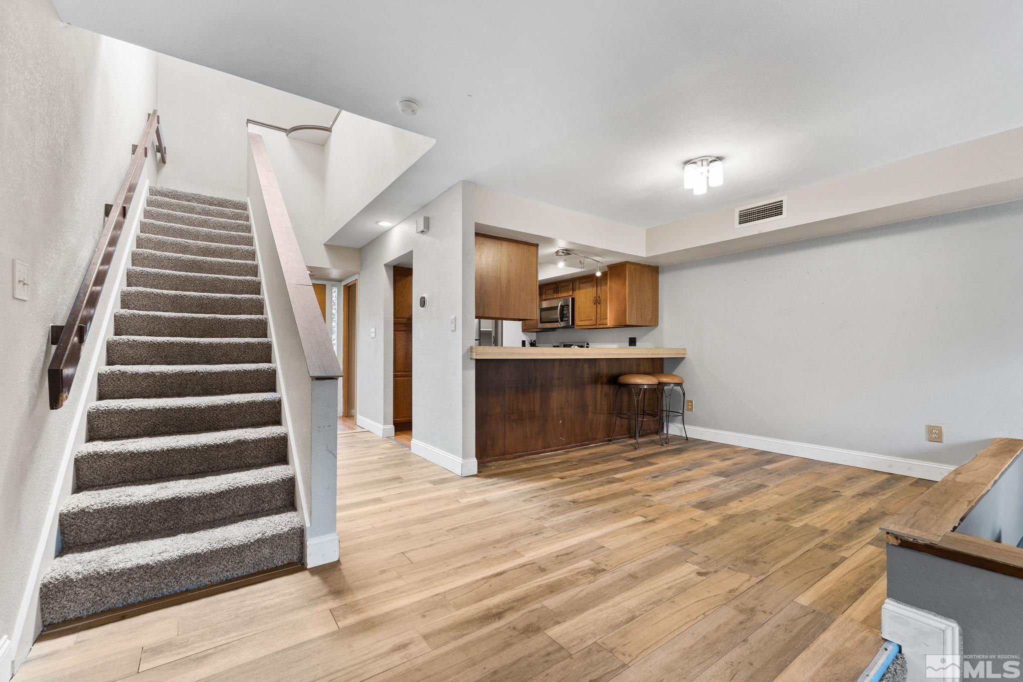 4185 Baker Lane Reno, NV 89509 - Photo 8 of 29 a view of kitchen with cabinets and wooden floor