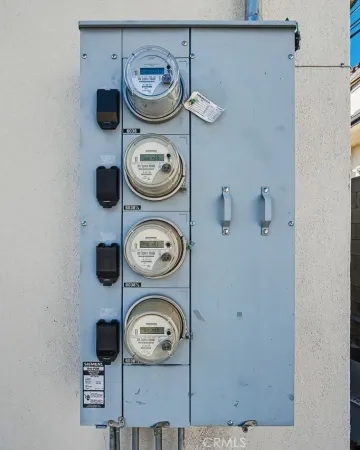 a living room with furniture and a dining table with many kitchen view