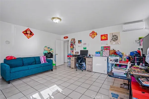 a view of play room with toys and a flat screen tv