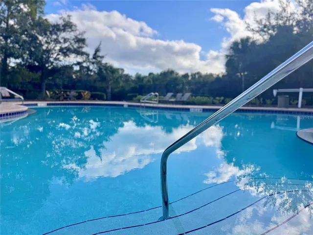 a view of a swimming pool with a sitting space