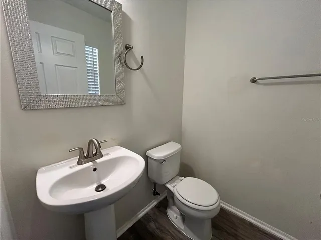 an empty room with closet and a chandelier fan