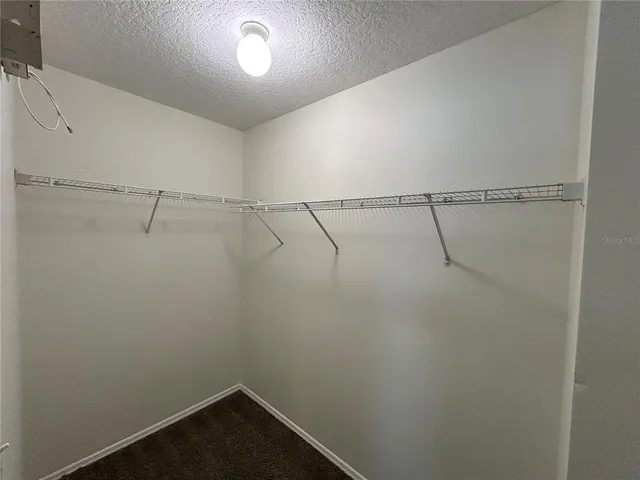 a bathroom with a bathtub a sink a toilet and a window