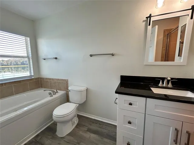 a bathroom with a shower and a mirror