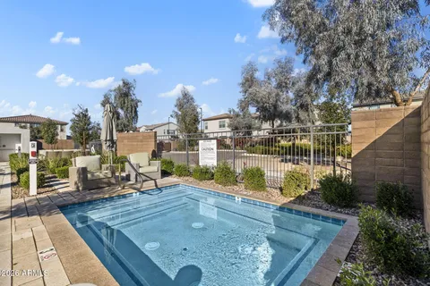 a view of a swimming pool with a lounge chairs