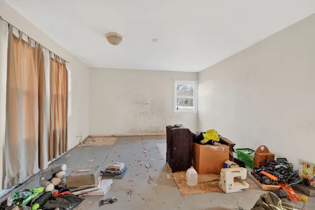 a view of storage and utility room with a window