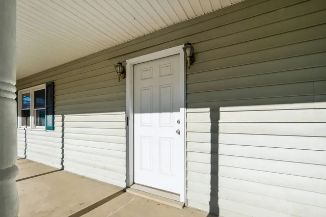 front view of a house with a garden