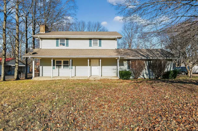 a view of balcony with wooden floor and outdoor seating
