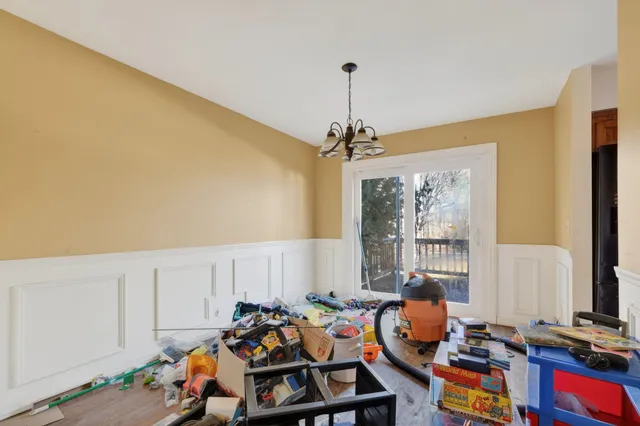 a bedroom with furniture and a window