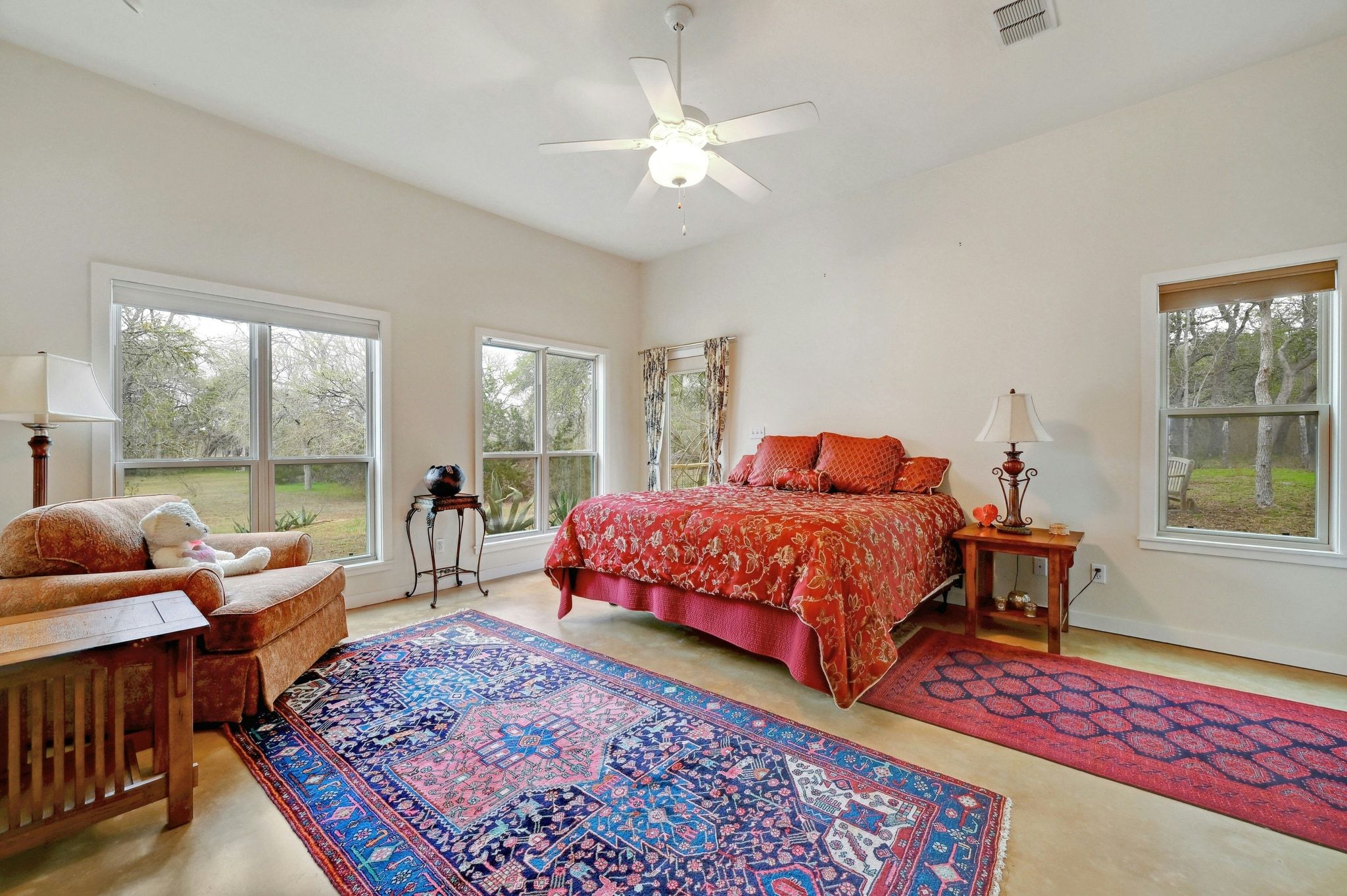 2147 Tejas Trail Blanco, TX 78606 - Photo 13 of 29 a bedroom with a bed a couch and a window