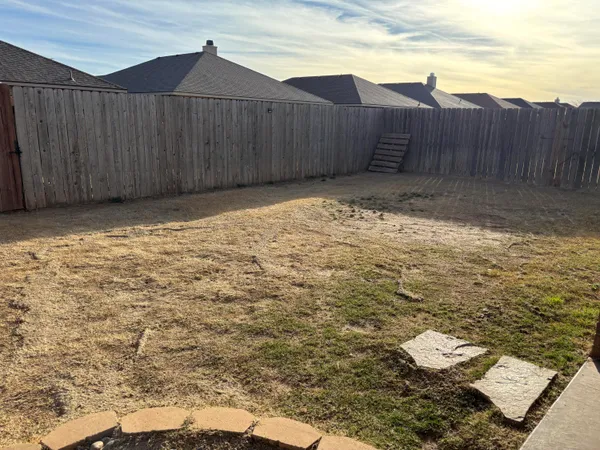 a view of a backyard of the house