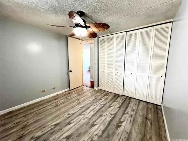 a view of a room with a ceiling fan