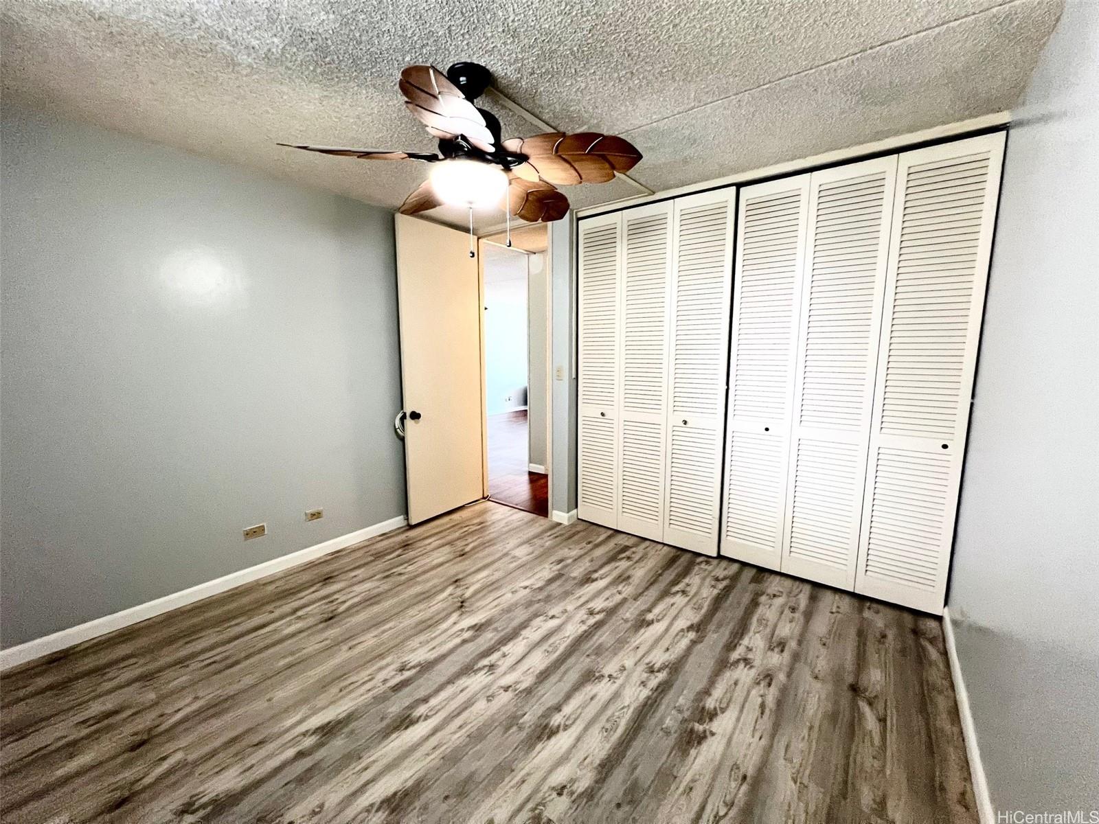 469 Ena Road, Unit 2010 Honolulu, HI 96815 - Photo 14 of 25 a view of empty room with wooden floor