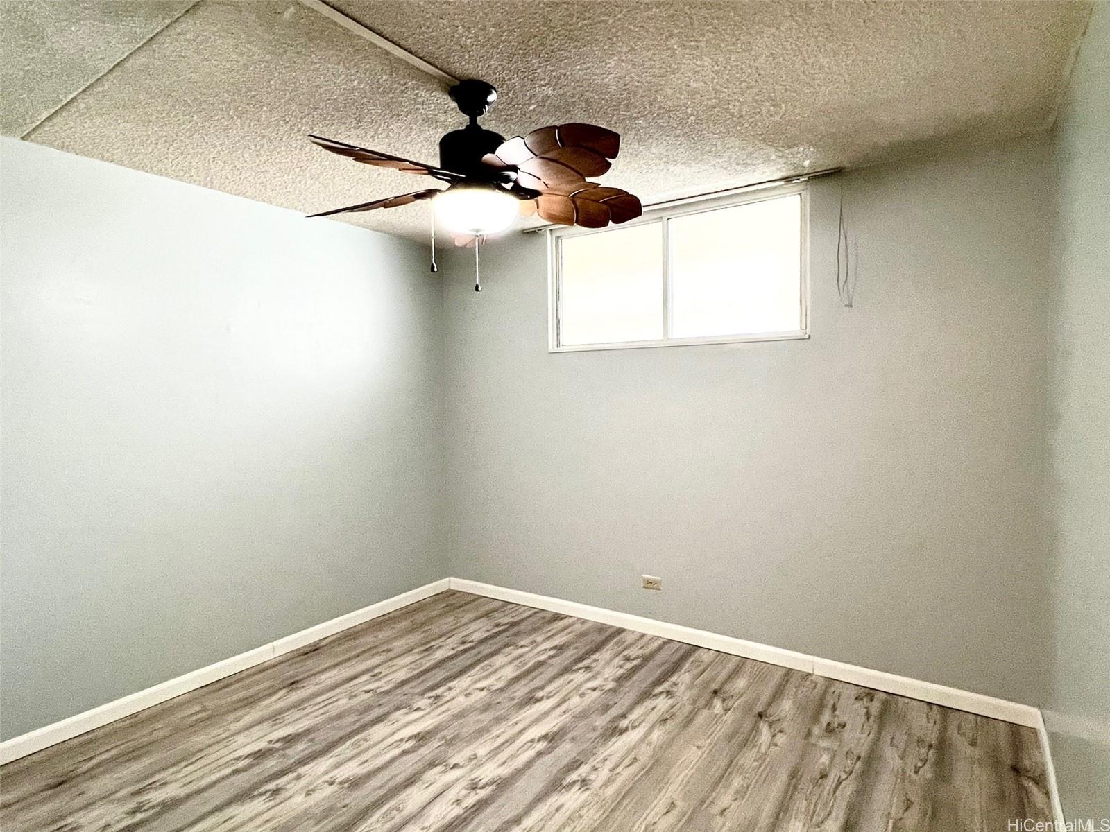 469 Ena Road, Unit 2010 Honolulu, HI 96815 - Photo 15 of 25 a view of a room with a ceiling fan