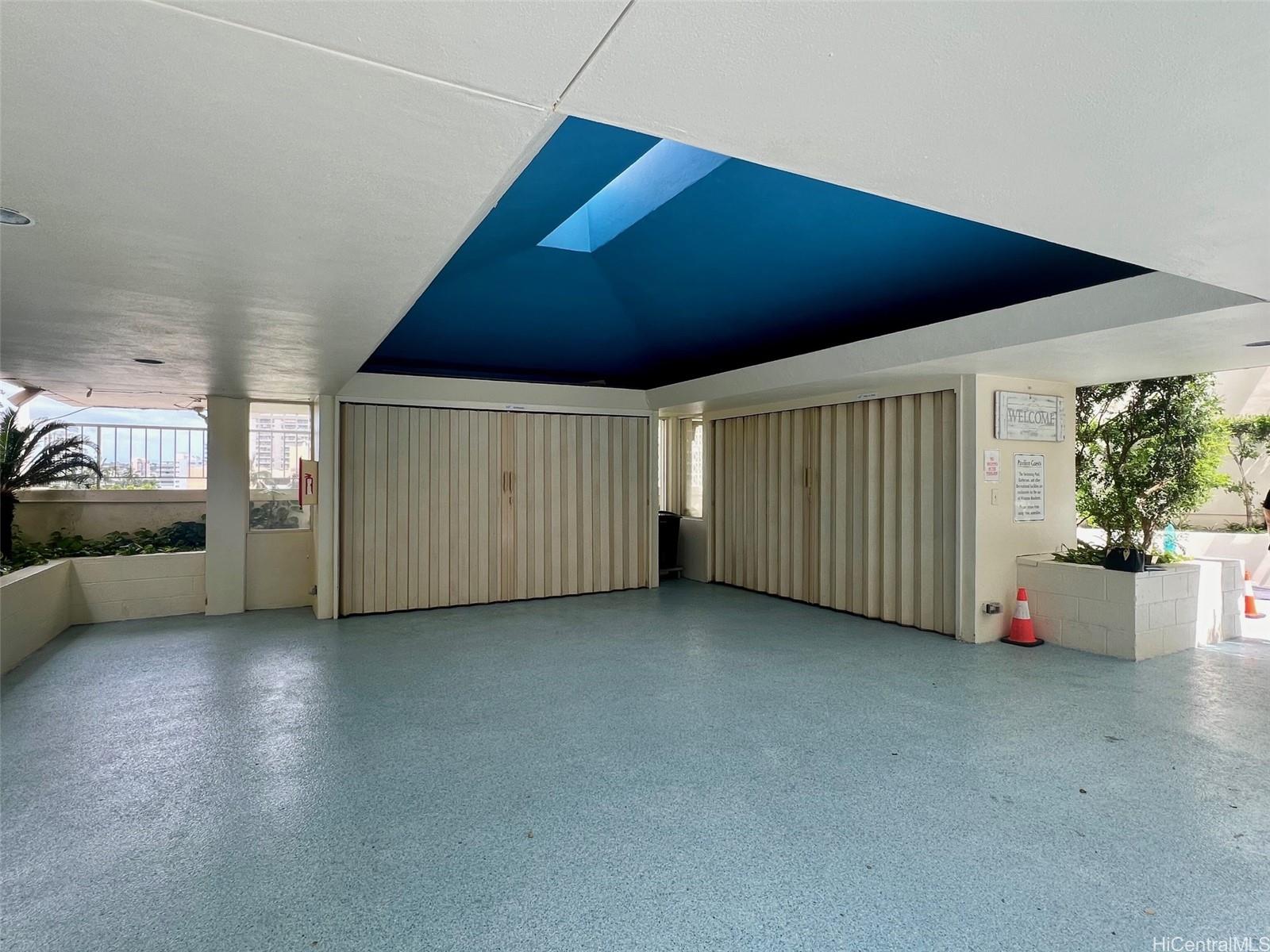 469 Ena Road, Unit 2010 Honolulu, HI 96815 - Photo 23 of 25 a view of a livingroom with furniture and staircase