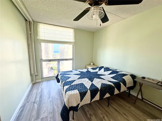 a bathroom with a double vanity sink and mirror with bathtub