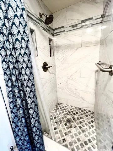 a kitchen with a refrigerator a sink and cabinets