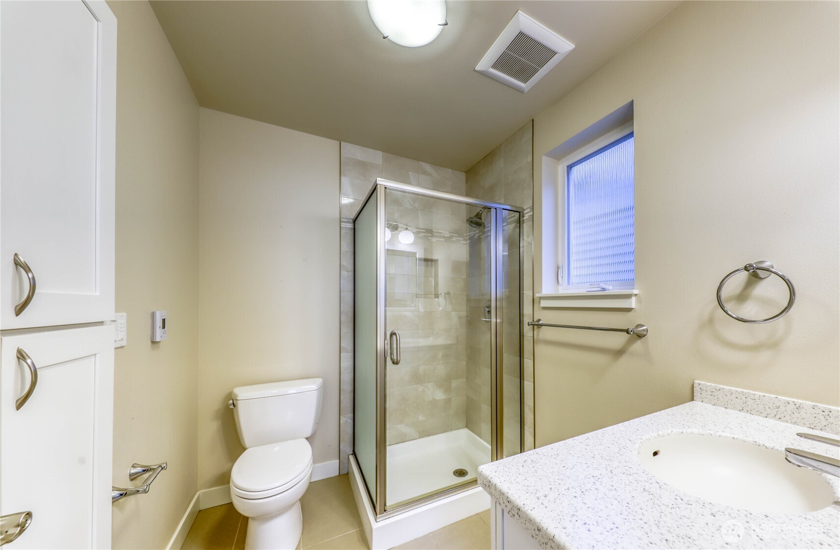 690 Wintersweet Road Northeast Bainbridge Island, WA 98110 - Photo 20 of 23 a bathroom with a sink toilet and shower