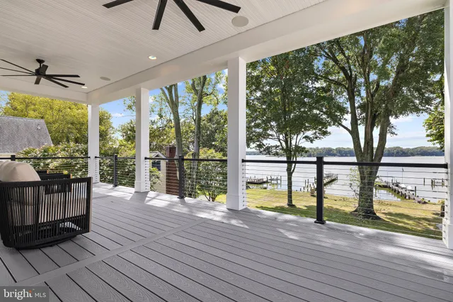 a view of living room with hardwood floor and furniture