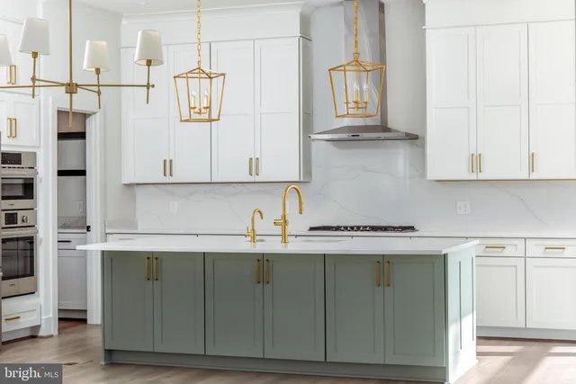 a kitchen with stainless steel appliances granite countertop a sink and cabinets