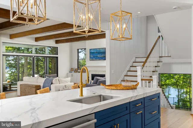 a view of a living room and kitchen