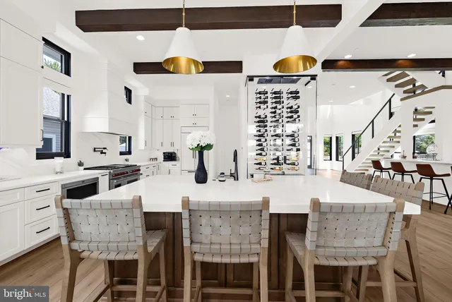 a dining room with furniture and wooden floor