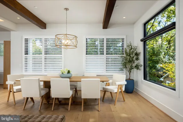 a view of a dining room with furniture and windows