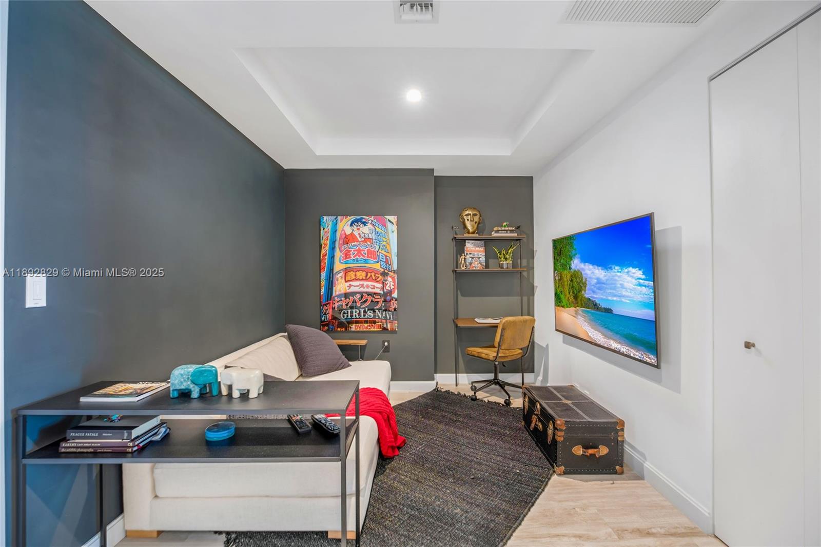 55 Southwest 9th Street, Unit 3205 Miami, FL 33130 - Photo 15 of 39 a living room with furniture and a flat screen tv