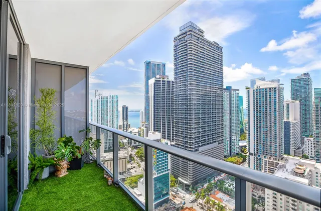 a view of a balcony with city view
